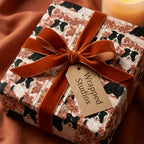 Autumn Border Collie wrapping paper with a rust velvet bow and Wrapped Studios gift tag.