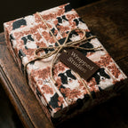 Rustic Border Collie dog wrapping paper with autumn leaves and twine bow by Wrapped Studios.