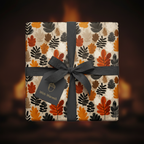 Autumn leaf gift wrap with gray ribbon on square gift box.