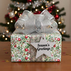 Christmas gift with floral wrapping paper, silver ribbon, and "Season's Greetings" star tag.