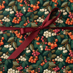 Elegant Christmas wrapping paper with a botanical berry print and a burgundy satin ribbon.