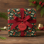 Square gift wrapped in festive floral Christmas gift wrap with a red ribbon and bow.