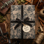 Elegant vintage floral wrapping paper with a grey velvet ribbon and "With Love" tag.