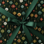 Dark floral wrapping paper with green satin ribbon bow, elegant gift wrap.