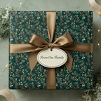 Elegant Christmas gift wrapped in dark green floral wrapping paper with gold ribbon and "From Our Family" tag.
