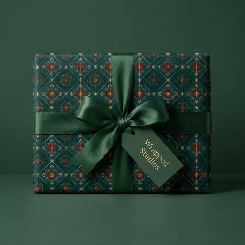 Luxury Christmas gift wrap with green and gold vintage pattern, satin ribbon bow, and Wrapped Studios tag.
