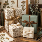 Vintage botanical wrapping paper and sage green gift wrap with elegant ribbons, by Wrapped Studios.