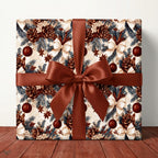 Rustic Christmas wrapping paper with vintage pinecone print and brown satin ribbon by Wrapped Studios.