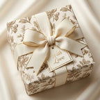 Vintage botanical wrapping paper with luxury cream bow and gold With Love tag by Wrapped Studios.