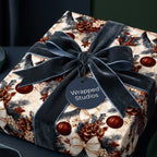 Luxury Christmas gift wrap with vintage pinecone pattern and blue velvet bow, by Wrapped Studios.