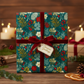 Teal floral wrapping paper with red berries, tied with a velvet ribbon for a luxury Christmas gift presentation.