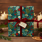 Teal floral wrapping paper with red berries, tied with a velvet ribbon for a luxury Christmas gift presentation.