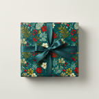 Square gift box wrapped in teal floral Christmas wrapping paper with a teal satin ribbon bow.
