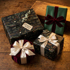 Elegant gifts wrapped in library bookshelf wrapping paper with velvet and satin ribbons.