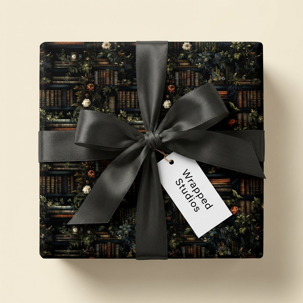 Square gift wrapped in vintage-style bookshelf & floral wrapping paper with dark gray satin ribbon.