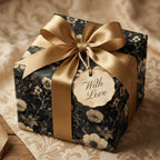 Elegant floral wrapping paper featuring a gold satin ribbon, tag reads "With Love."