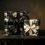 Elegant floral wrapping paper with black and gold ribbons by Wrapped Studios.