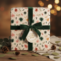 Elegant Christmas gift wrap with a festive botanical pattern, tied with a luxurious green velvet ribbon and a "something special" tag, on a rustic wooden table with pinecones.