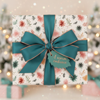 Elegant holiday wrapping paper with a festive floral and greenery pattern, featuring a teal ribbon bow and "A warm embrace" gift tag, perfect for Christmas.