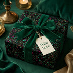 Elegant gift wrapped in dark floral wrapping paper, with a lush green velvet ribbon and a "With Love" tag.