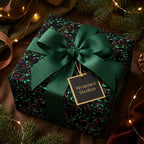 Wrapped Studios luxury gift wrap. Elegant floral wrapping paper with green ribbon for Christmas or holiday gifts.