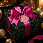 Elegant floral wrapping paper, perfect for birthday gifts. Features a pink ribbon bow and "Celebrate" tag. Wrapped Studios.