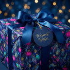 Elegant navy blue Christmas wrapping paper with magenta ornaments and a satin bow by Wrapped Studios.