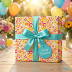 Bright floral wrapping paper with aqua ribbon for a happy birthday gift from Wrapped Studios.