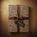 Elegant gift box wrapped in floral wrapping paper with a brown satin ribbon and a tag.