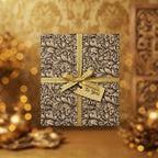 Elegant floral wrapping paper on a square gift box with a gold ribbon and "To You" tag.