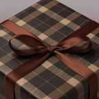 Elegant gift box wrapped in brown plaid paper with a matching satin ribbon bow.