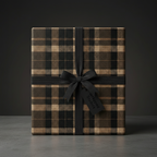 Elegant gift box wrapped in brown and black plaid wrapping paper with a black ribbon.