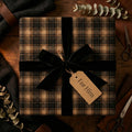 Rustic "For Him" gift wrapped in brown plaid wrapping paper with a black velvet ribbon bow.