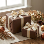 Brown wrapping paper gifts with ivory & gold ribbon, festive holiday decor for Christmas or birthday present wrapping.
