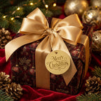 Luxury red and gold Christmas wrapping paper with a satin bow by Wrapped Studios.