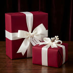 Elegant burgundy wrapping paper with white satin ribbon; gift-wrapped presents for Christmas, birthday, or special occasion.