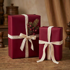 Elegant maroon gift boxes wrapped with lace & velvet ribbon, perfect for Christmas or special occasion presents.