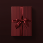 Burgundy striped wrapping paper with satin ribbon bow for elegant gift presentation.
