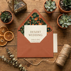 Desert wedding invitation in terracotta envelope with cactus floral liner by Wrapped Studios.