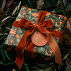 Luxury cactus floral wrapping paper with a burnt orange velvet bow by Wrapped Studios.