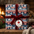 Canadian Christmas wrapping paper with red velvet bow in a cozy fireplace setting by Wrapped Studios.