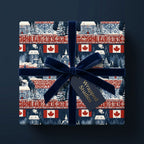 Canadian Christmas wrapping paper with snowy cabins, tied with a blue velvet ribbon by Wrapped Studios.