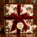 Vintage Christmas gift wrap with a candy cane pattern and red velvet bow by Wrapped Studios.
