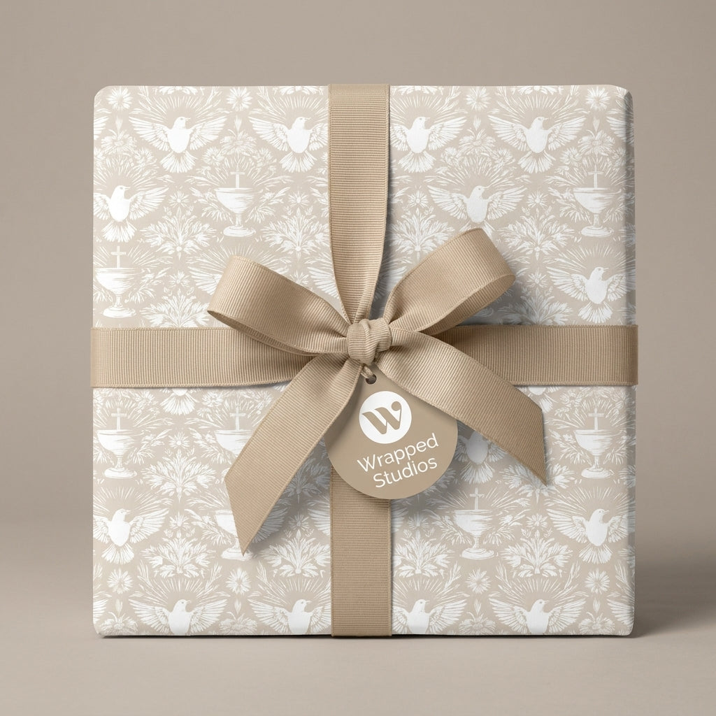 Baptism wrapping paper with white doves and chalices, tied with a beige ribbon bow by Wrapped Studios.