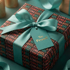Modern congratulations wrapping paper with a teal ribbon and 'So Proud' tag by Wrapped Studios.