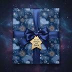 Navy blue celestial wrapping paper featuring stars, moons, and a "To the moon and back" gift tag.