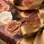 Celestial floral wrapping paper with dusty pink roses and gold ribbon by Wrapped Studios.