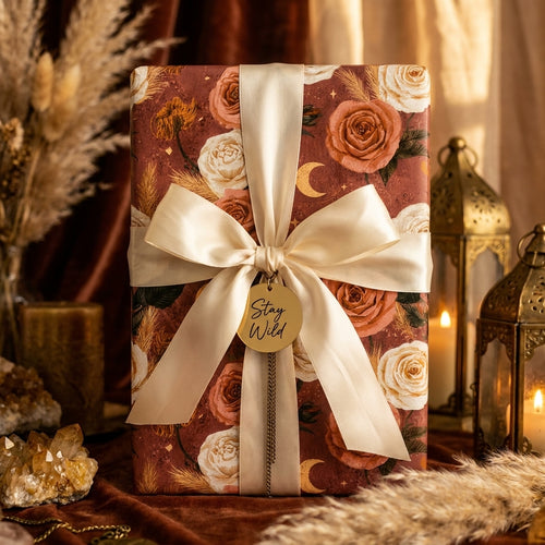 Luxury terracotta boho floral wrapping paper with a cream satin bow on a gift box, by Wrapped Studios.