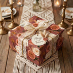 Boho floral wrapping paper with a lace bow on a romantic wedding gift box by Wrapped Studios.