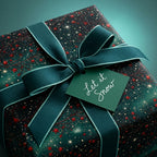 Luxury green Christmas wrapping paper with stars, teal bow, and 'Let it Snow' tag by Wrapped Studios.